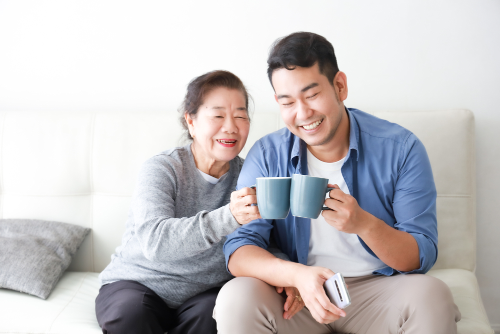 Two people seated on a couch