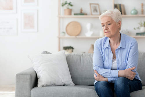 An elderly woman on a couch