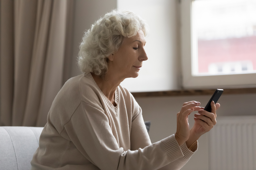 An older woman using a smartphone