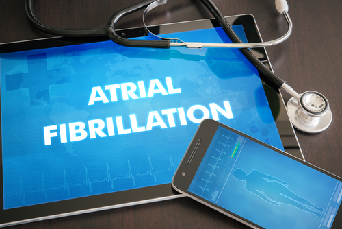 An electronic device screen displays the text "Atrial Fibrillation"