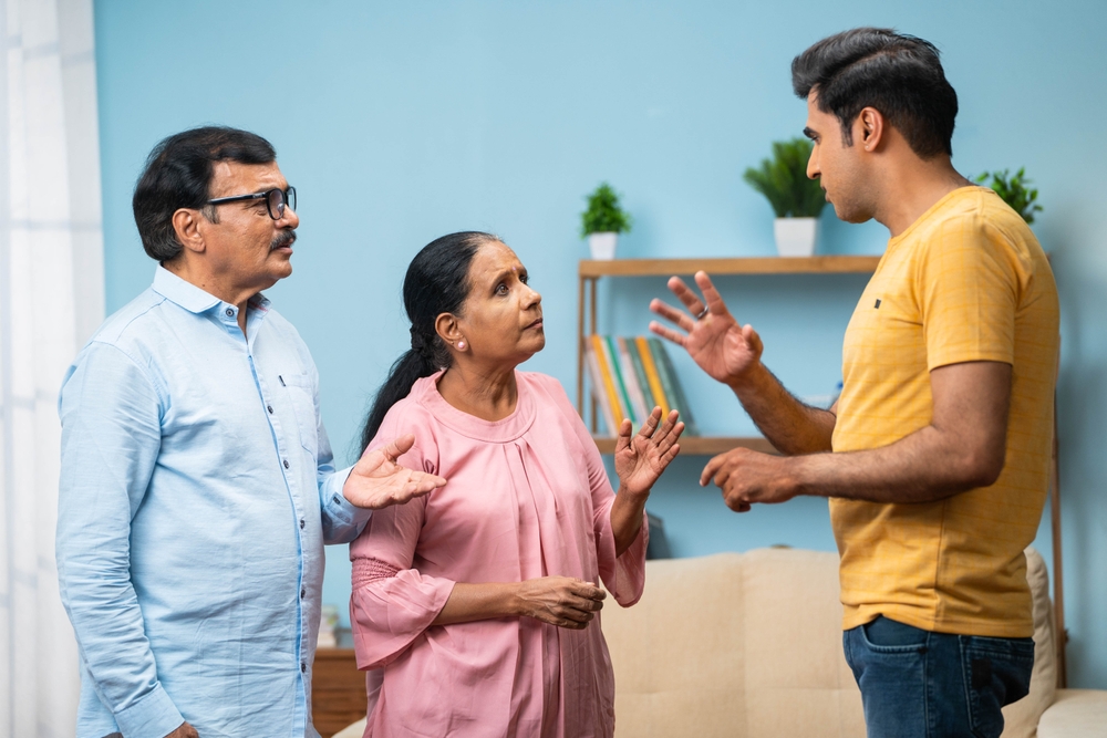 Three people are engaged in a serious conversation