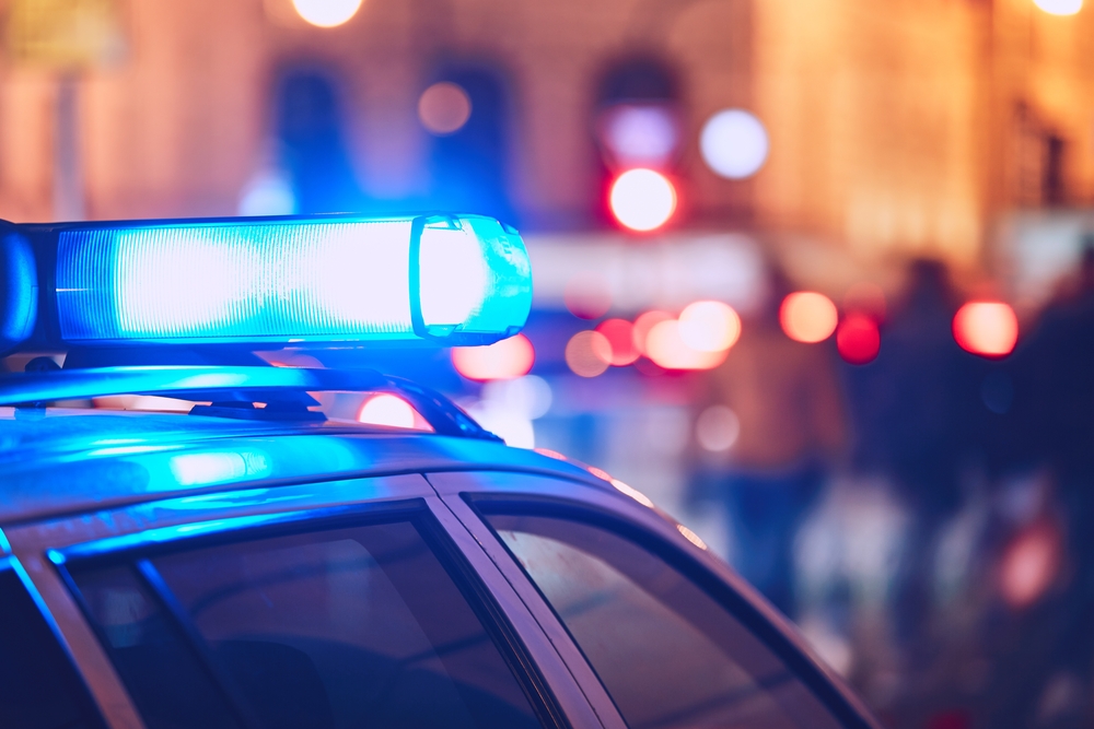 Close-up of a police car with blue lights flashing