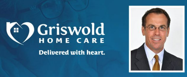 Griswold Home Care logo next to a portrait of a man in a suit and tie. The tagline reads "Delivered with heart" reflecting their commitment to exceptional home health care service.